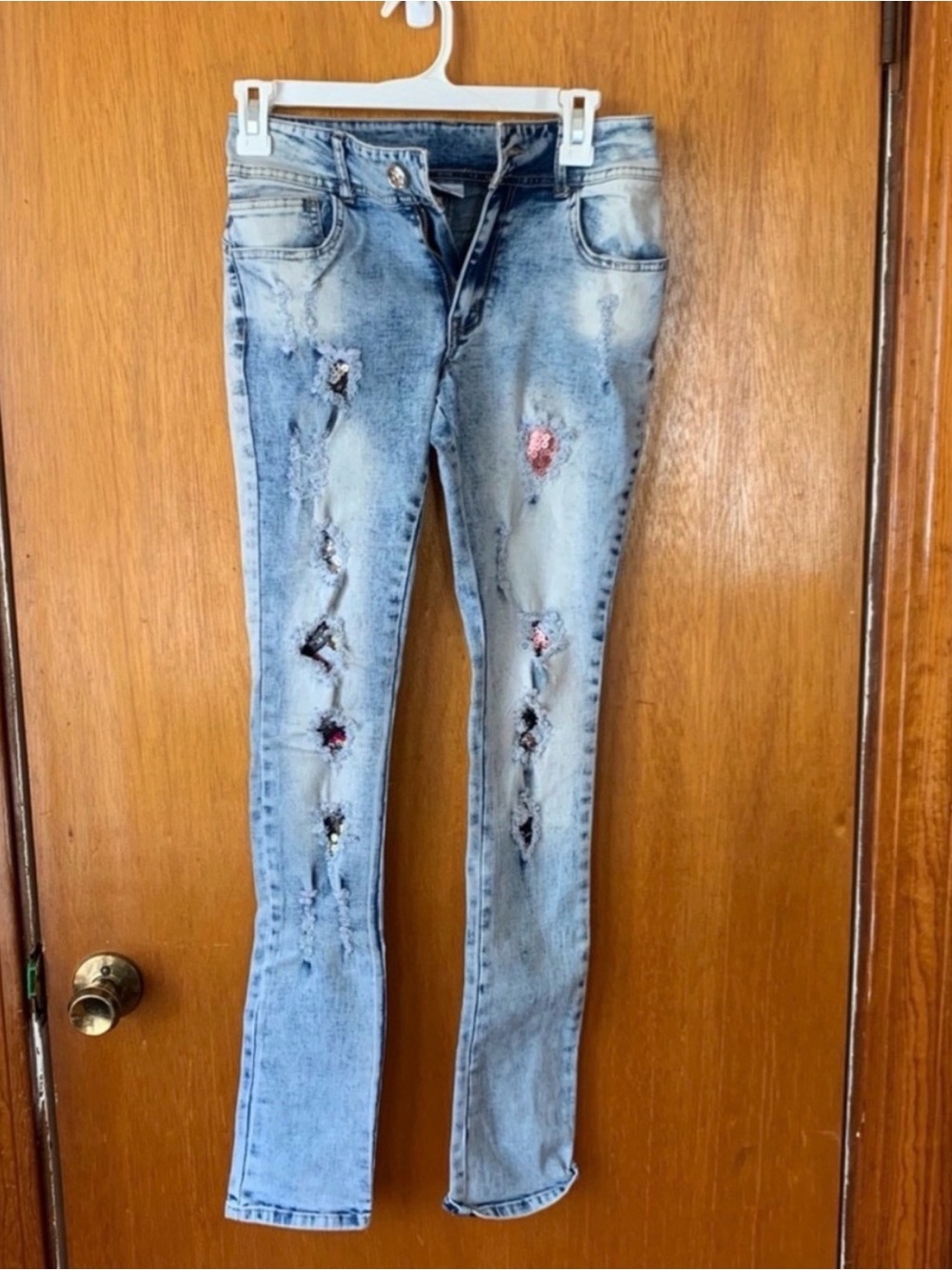 Light Wash Distressed Women’s Jeggings with Sequin Patch Details
